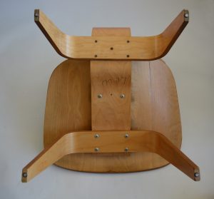 The bottom of Eames wood lounge chair