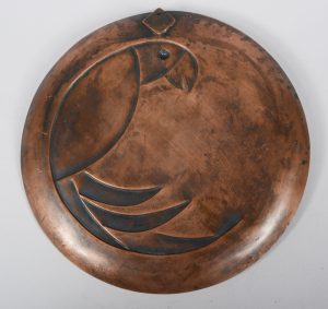 Rebajes copper plaque with art deco parrot